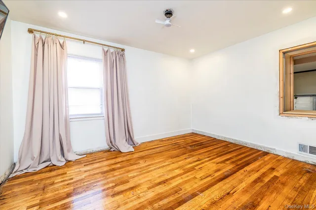 a view of a hallway with windows