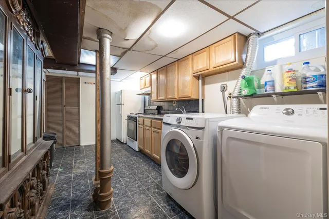 a kitchen with a refrigerator sink and cabinets