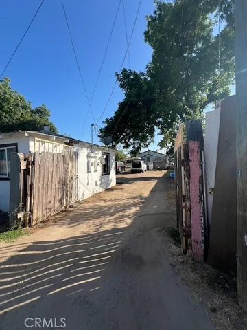 a kitchen view of a table and chairs