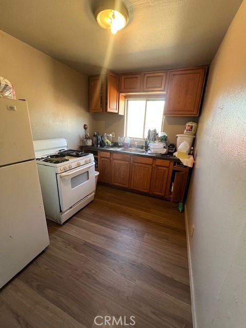 809 South B Street Madera, CA 93638 - Photo 7 of 20 a kitchen with granite countertop white cabinets and white appliances