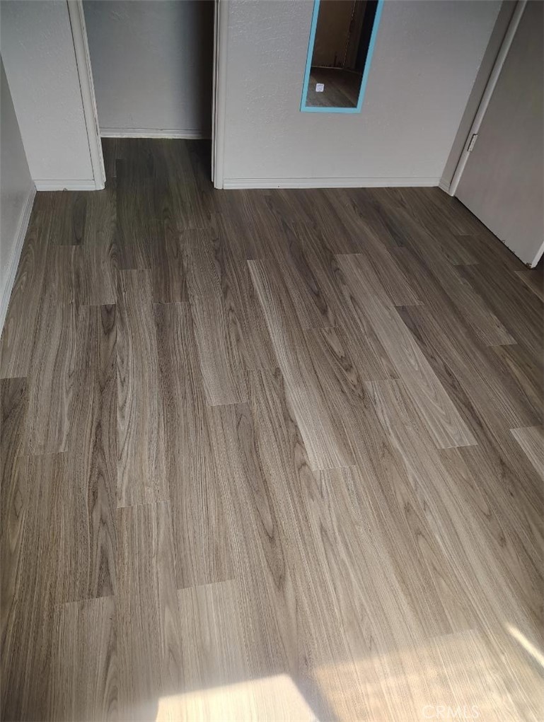 809 South B Street Madera, CA 93638 - Photo 9 of 20 a view of a hallway with wooden floor