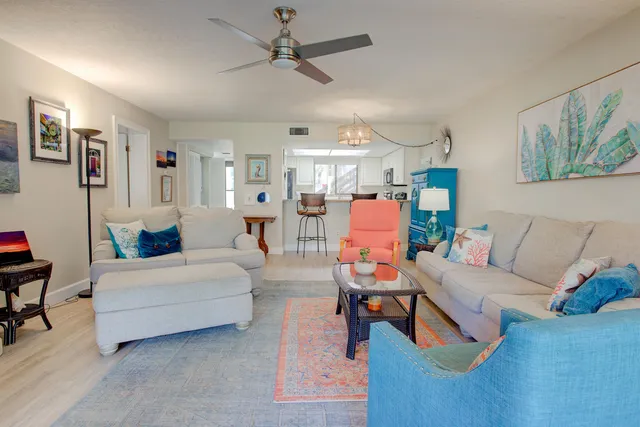 a spacious bedroom with a bed a couch and dresser