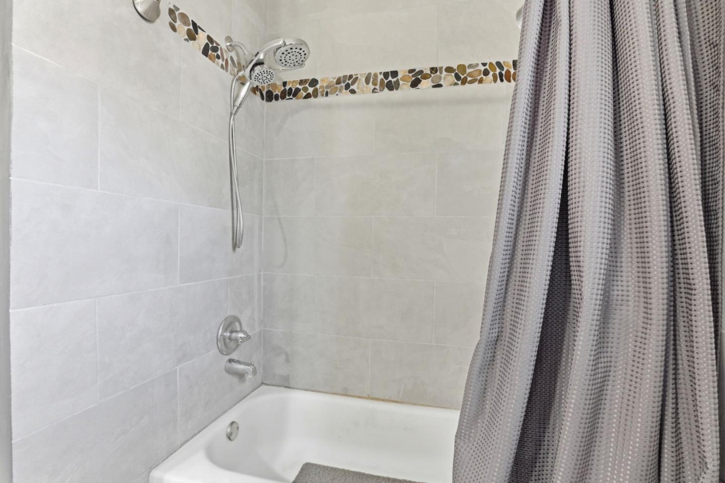 20 Russell Road, Unit 8 Salinas, CA 93906 - Photo 21 of 38 a bathroom with a shower and a tub