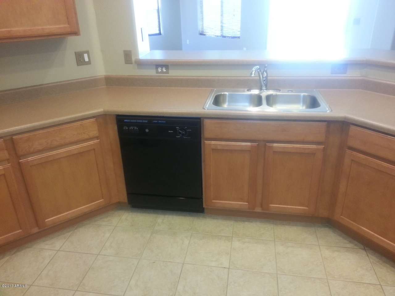 44395 Cypress Lane Maricopa, AZ 85138 - Photo 8 of 20 a kitchen with a sink and cabinets