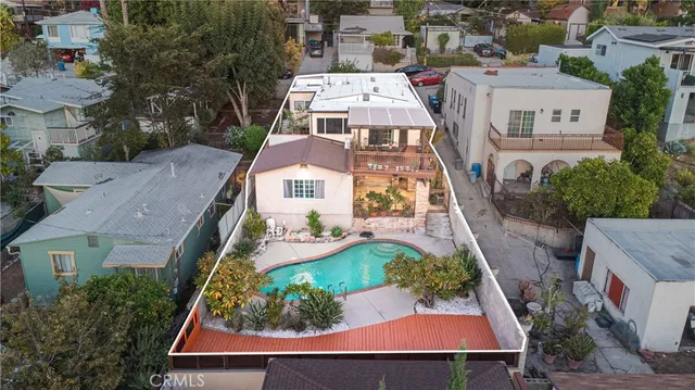 an aerial view of residential houses with outdoor space