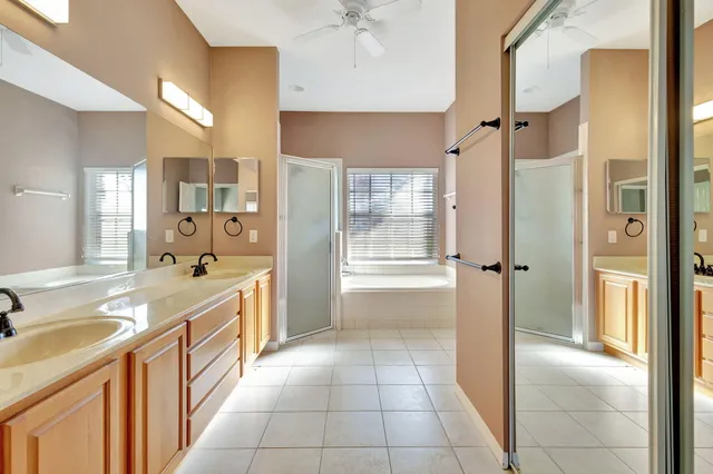 a view of kitchen with stainless steel appliances granite countertop refrigerator and sink
