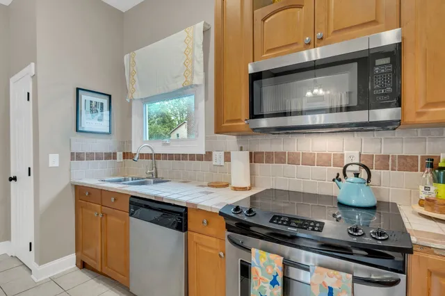 a kitchen with a stove and a microwave
