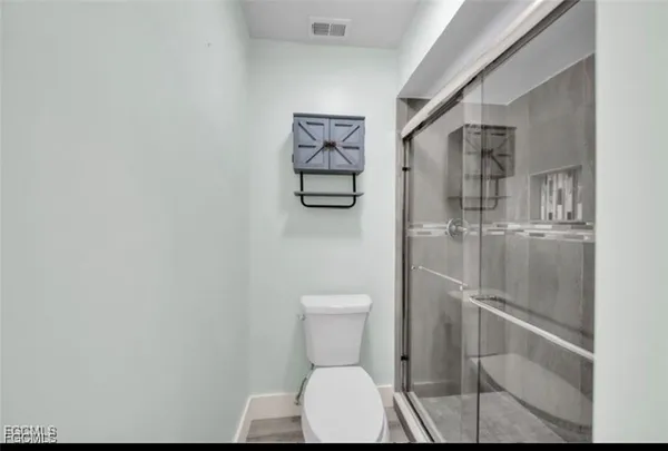 a view of a hallway with washer and dryer