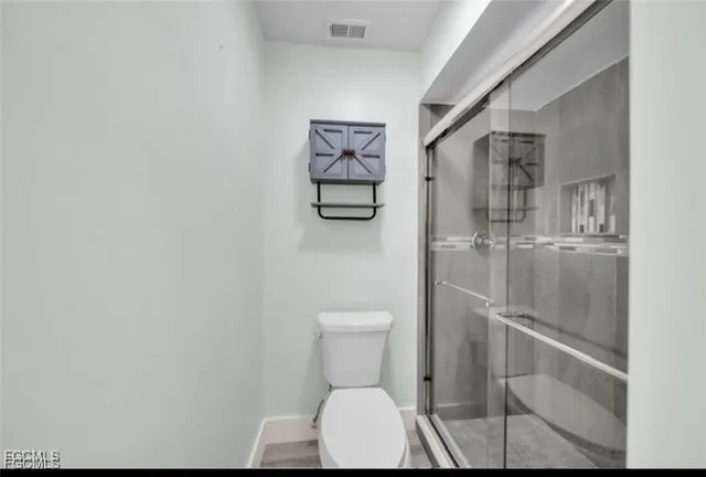 a view of a hallway with washer and dryer
