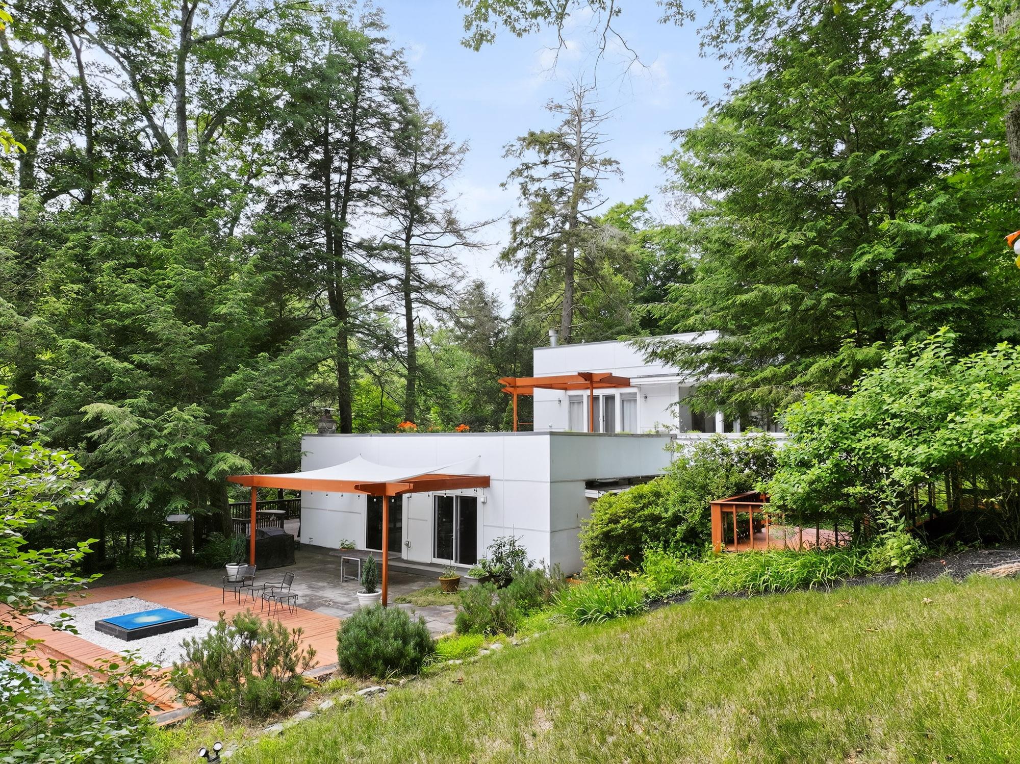1202 Jackson Corners Road Red Hook, NY 12571 - Photo 2 of 50 an aerial view of a house with yard and trees in the background