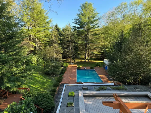 a view of a yard with chairs