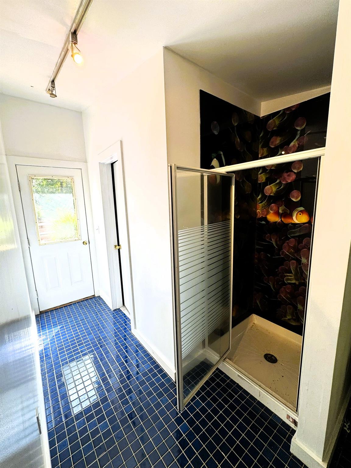 1202 Jackson Corners Road Red Hook, NY 12571 - Photo 32 of 50 a bathroom with a glass shower door and a window