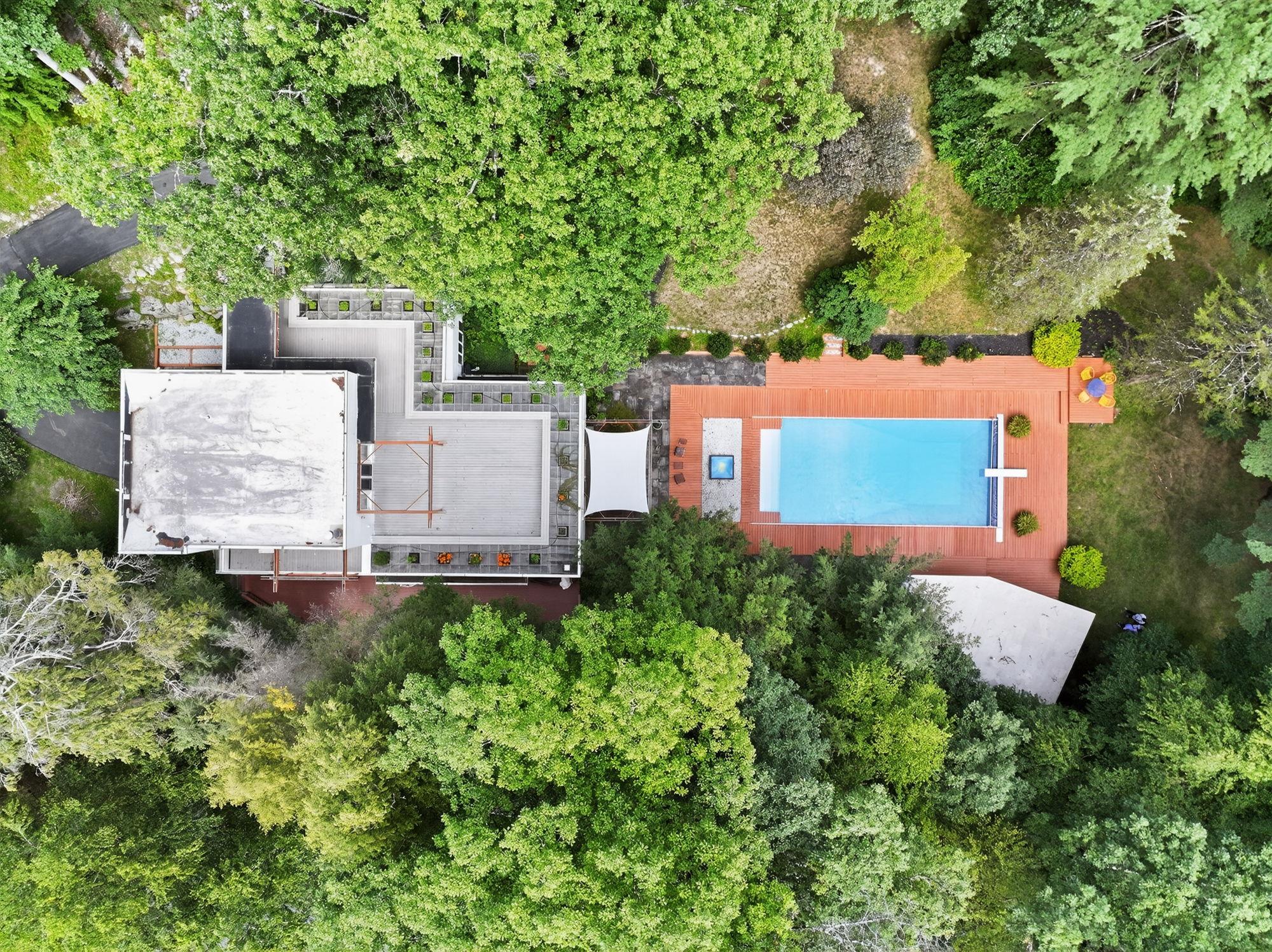 1202 Jackson Corners Road Red Hook, NY 12571 - Photo 39 of 50 an aerial view of a house with yard and trees in the background