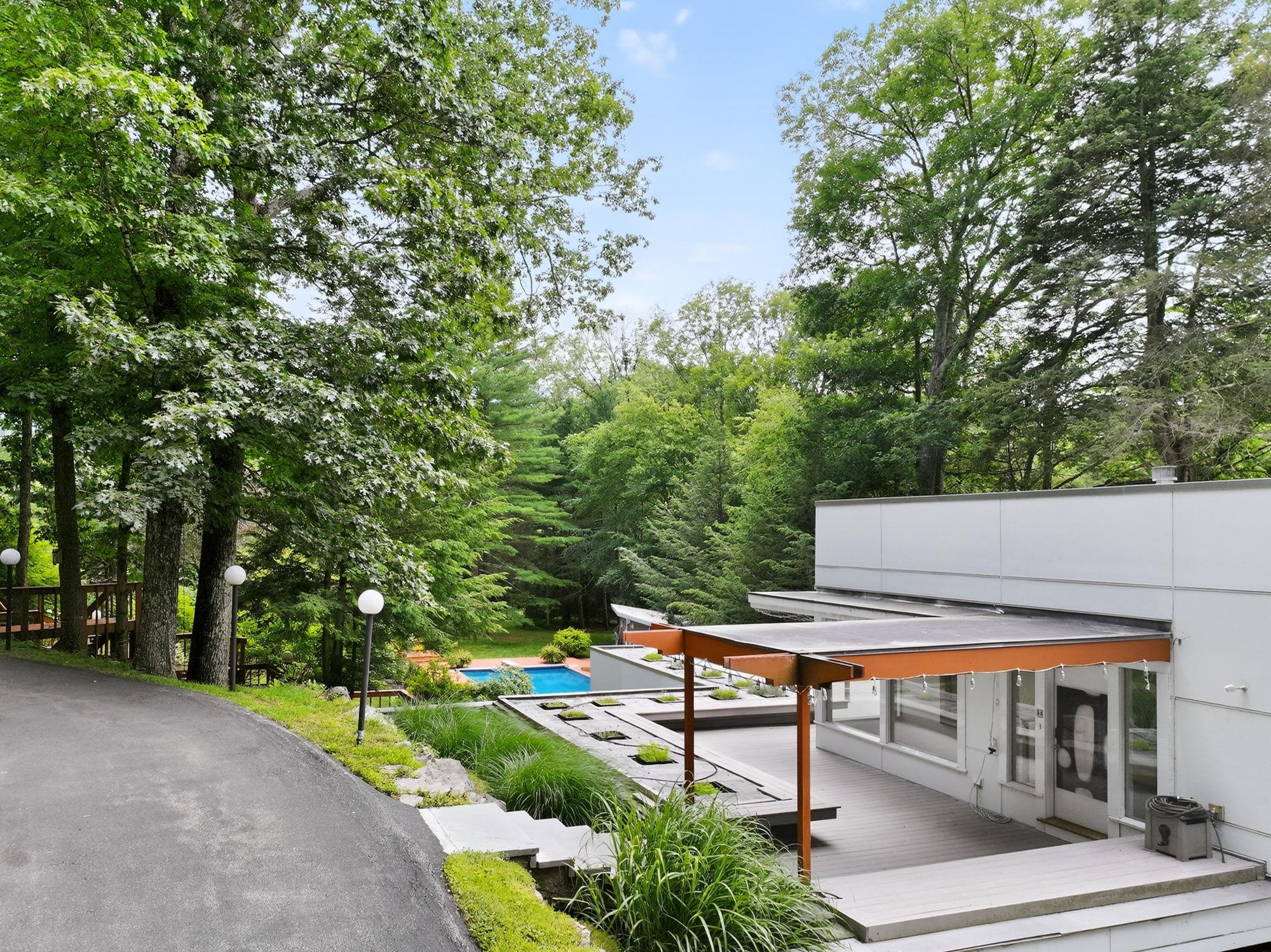 1202 Jackson Corners Road Red Hook, NY 12571 - Photo 43 of 50 a view of a chairs and table in the backyard