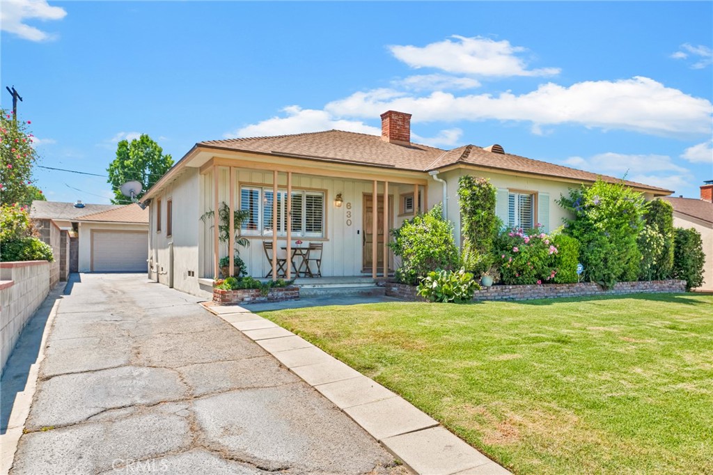a view of a house with a swimming pool and a porch