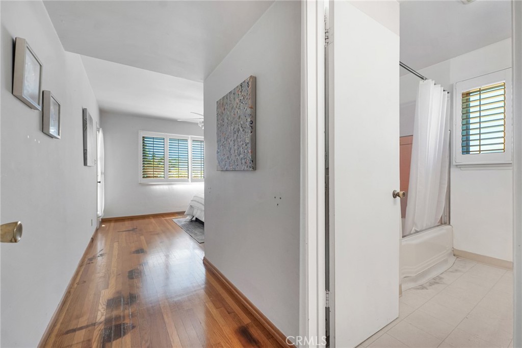 630 Uclan Drive Burbank, CA 91504 - Photo 22 of 41 a view of an empty room with wooden floor and a window
