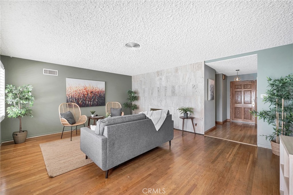 630 Uclan Drive Burbank, CA 91504 - Photo 23 of 41 a living room with furniture and a wooden floor