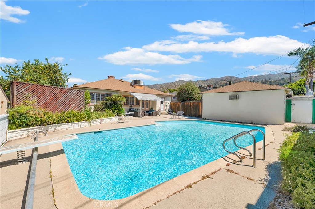 630 Uclan Drive Burbank, CA 91504 - Photo 24 of 41 a view of a house with a swimming pool