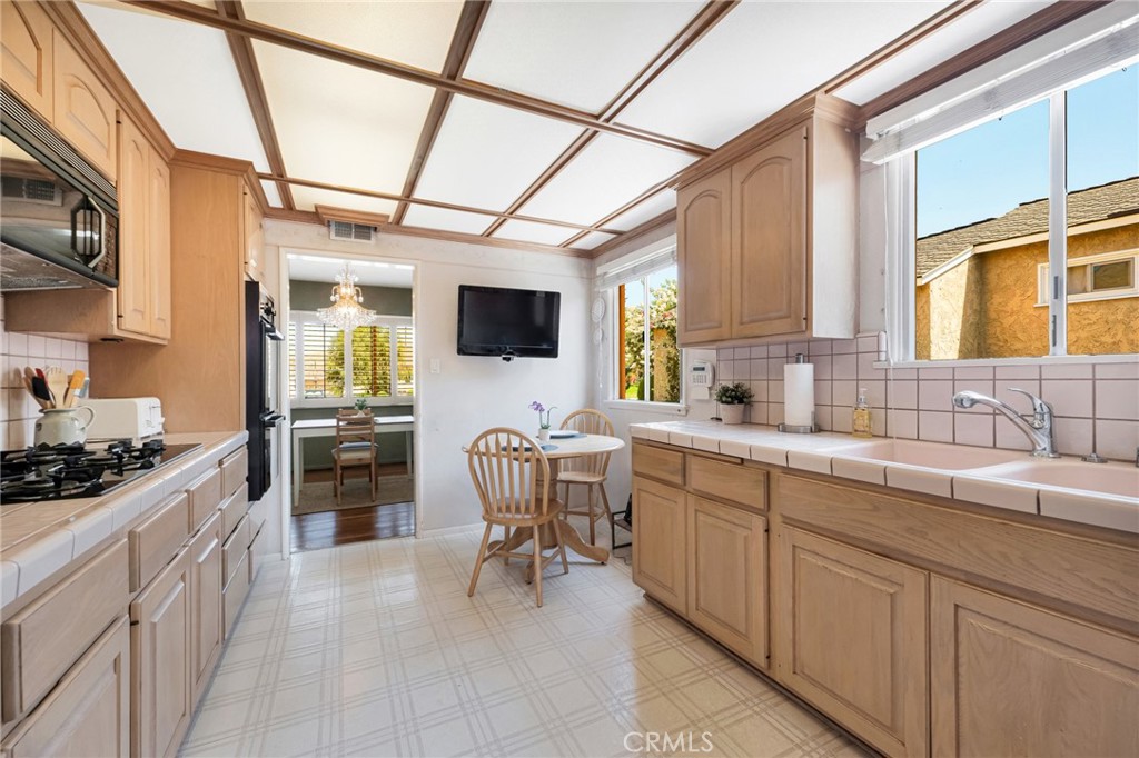 630 Uclan Drive Burbank, CA 91504 - Photo 6 of 41 a kitchen with a sink cabinets and window