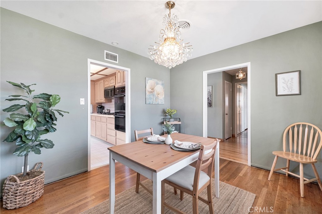 630 Uclan Drive Burbank, CA 91504 - Photo 7 of 41 a view of a dining room with furniture window and wooden floor