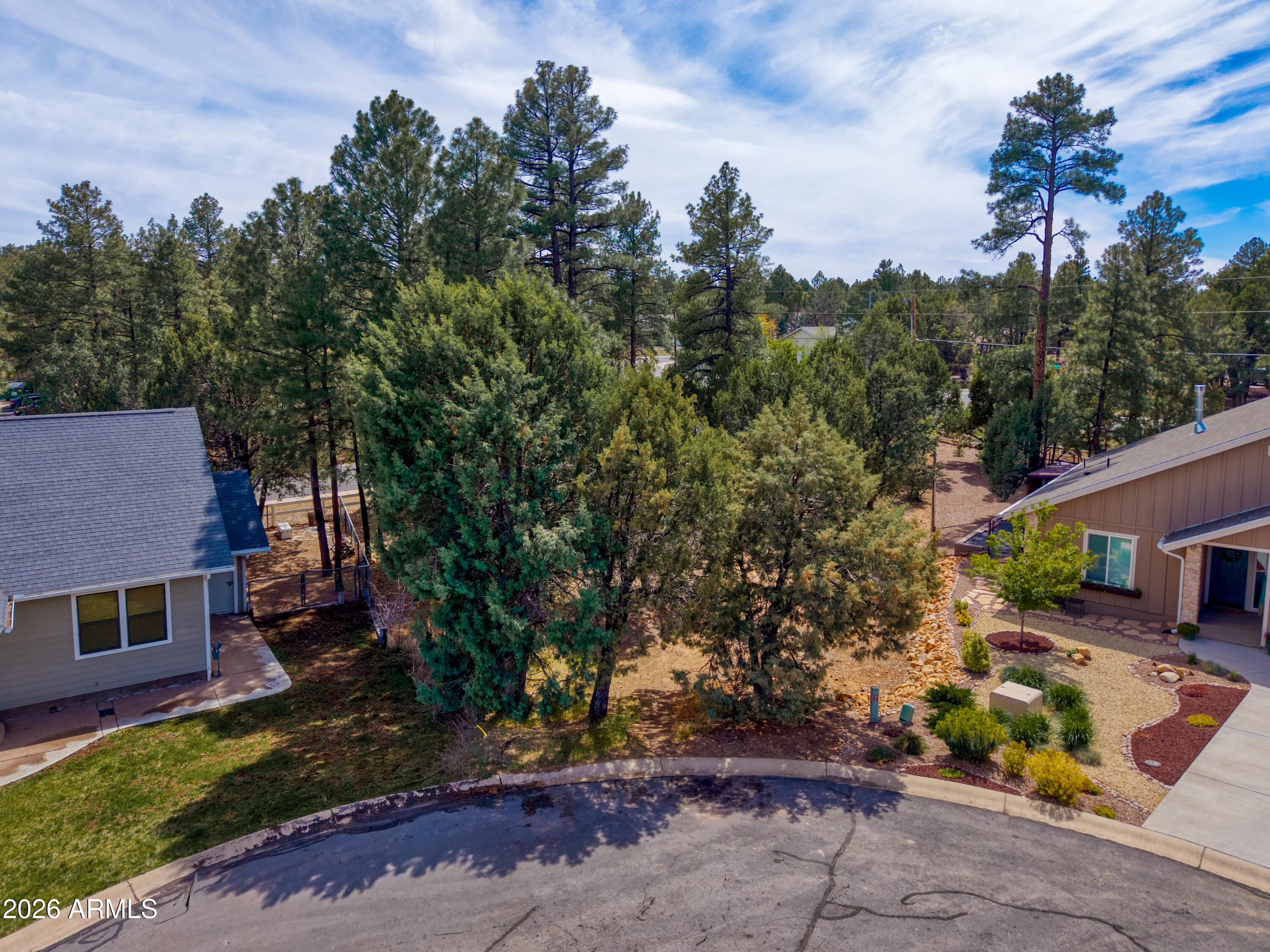 1541 West Huning, Unit 4 Show Low, AZ 85901 - Photo 1 of 7 a view of a house with a garden