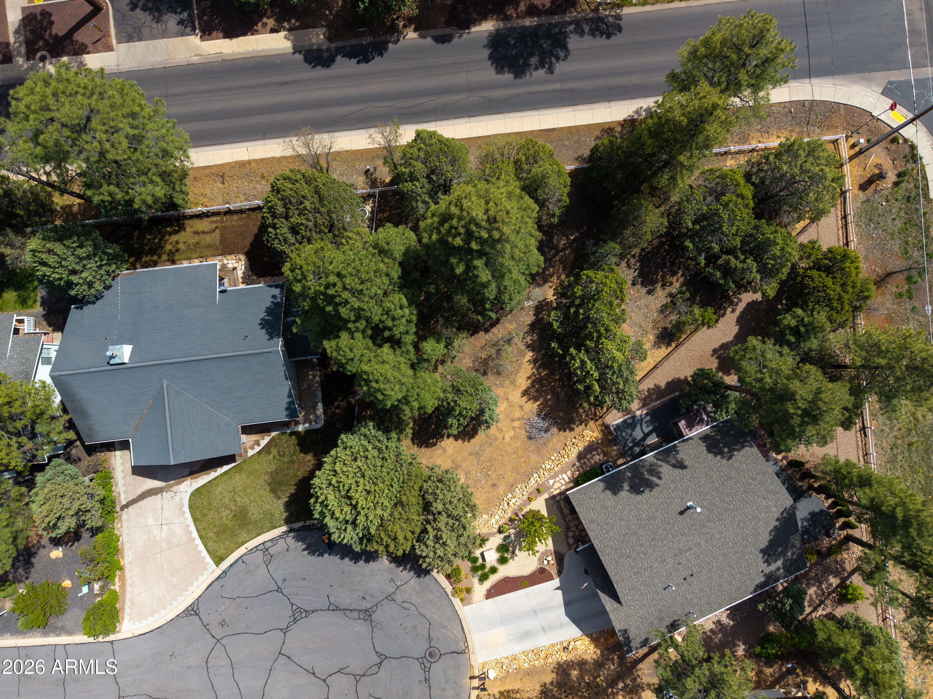 1541 West Huning, Unit 4 Show Low, AZ 85901 - Photo 3 of 7 an aerial view of a house with a yard and garden