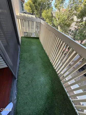 a view of a yard from a balcony