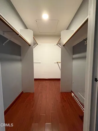 a view of hallway with wooden floor