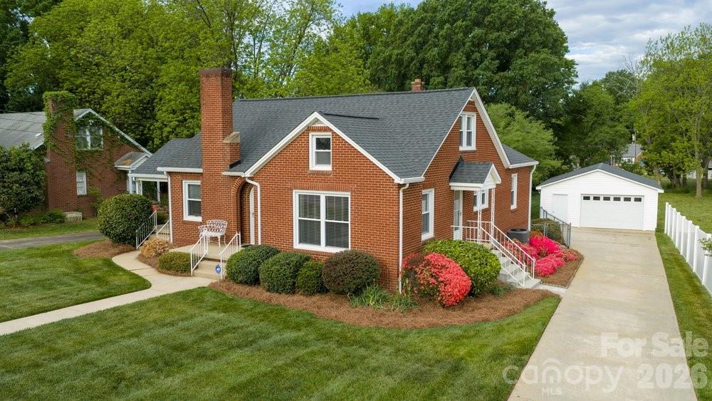 124 Rumple Street Troutman, NC 28166 - Photo 1 of 42 a front view of a house with a yard
