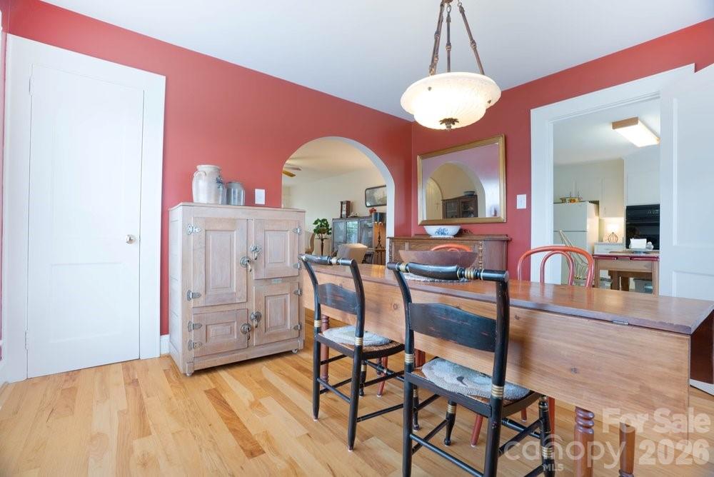 124 Rumple Street Troutman, NC 28166 - Photo 13 of 42 a view of a dining room with furniture and wooden floor