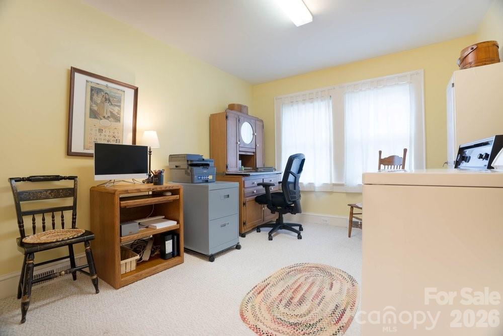 124 Rumple Street Troutman, NC 28166 - Photo 17 of 42 a view of a livingroom with workspace and a window