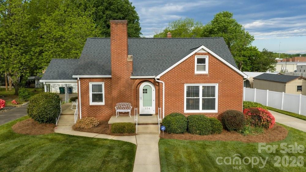 124 Rumple Street Troutman, NC 28166 - Photo 2 of 42 a front view of a house with a yard