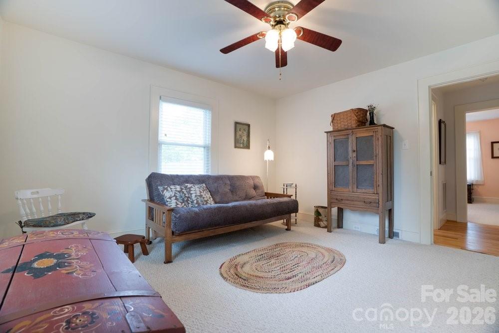 124 Rumple Street Troutman, NC 28166 - Photo 25 of 42 a living room with furniture and a couch