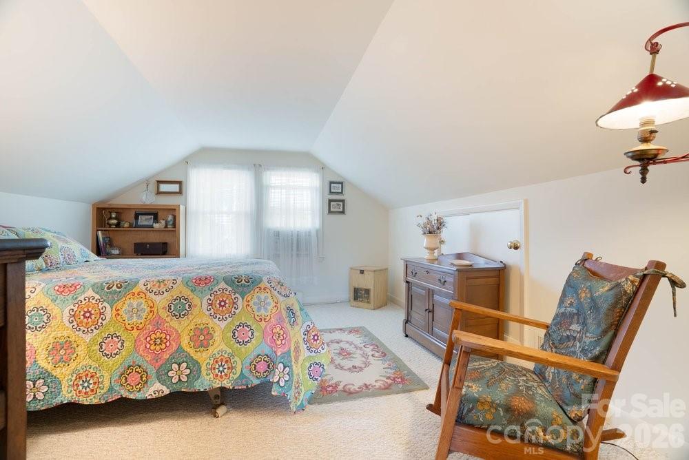 124 Rumple Street Troutman, NC 28166 - Photo 29 of 42 a bedroom with furniture and a wooden floor