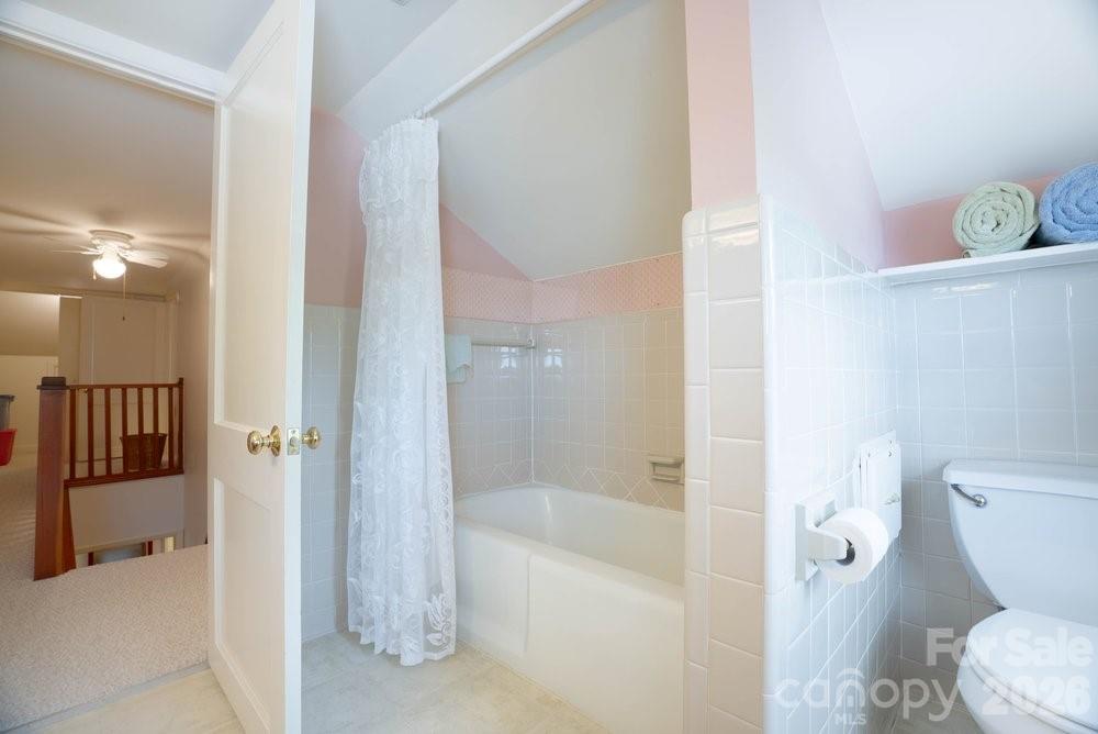 124 Rumple Street Troutman, NC 28166 - Photo 35 of 42 a bathroom with a bathtub and a shower