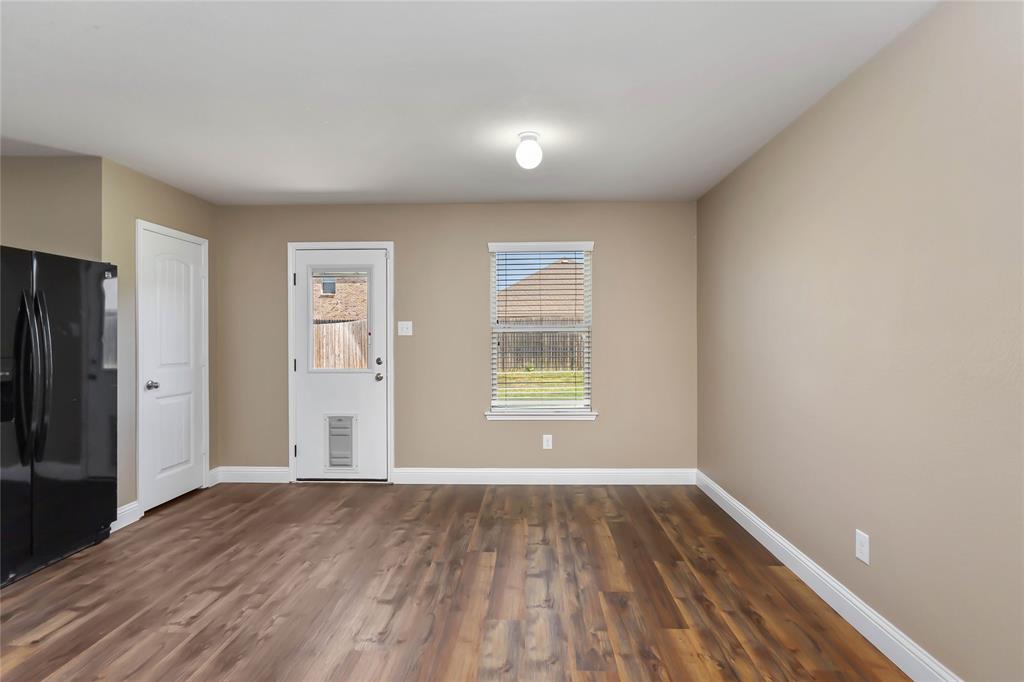 1450 Arabella Avenue Forney, TX 75126 - Photo 13 of 40 wooden floor in an empty room with a window
