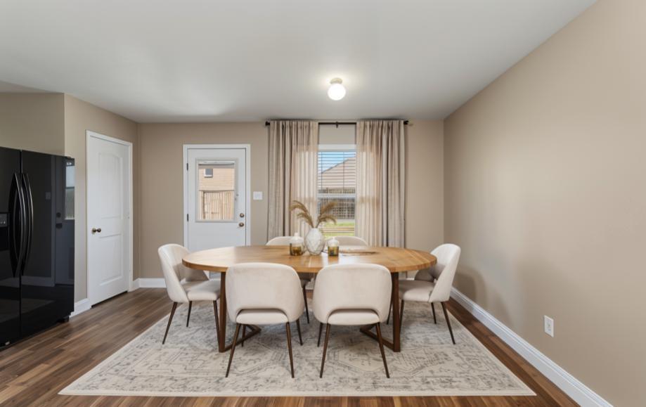 1450 Arabella Avenue Forney, TX 75126 - Photo 14 of 40 a view of a dining room with furniture window and wooden floor