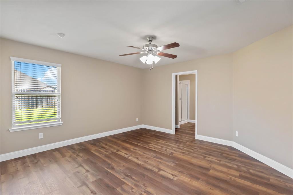 1450 Arabella Avenue Forney, TX 75126 - Photo 23 of 40 a view of an empty room with window and wooden floor