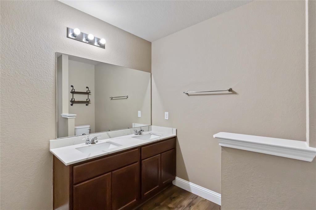 1450 Arabella Avenue Forney, TX 75126 - Photo 27 of 40 a bathroom with a sink and a mirror