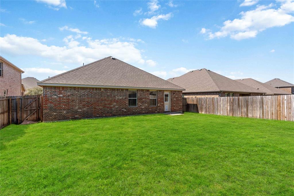 1450 Arabella Avenue Forney, TX 75126 - Photo 29 of 40 a view of a house with a yard and a large tree