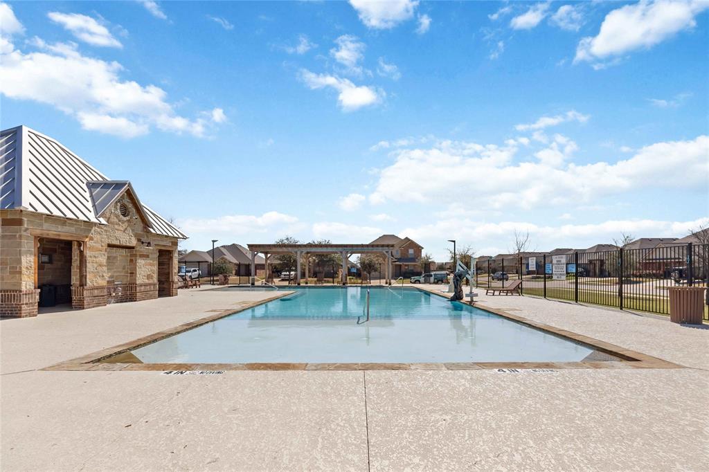 1450 Arabella Avenue Forney, TX 75126 - Photo 33 of 40 a view of a swimming pool with a terrace