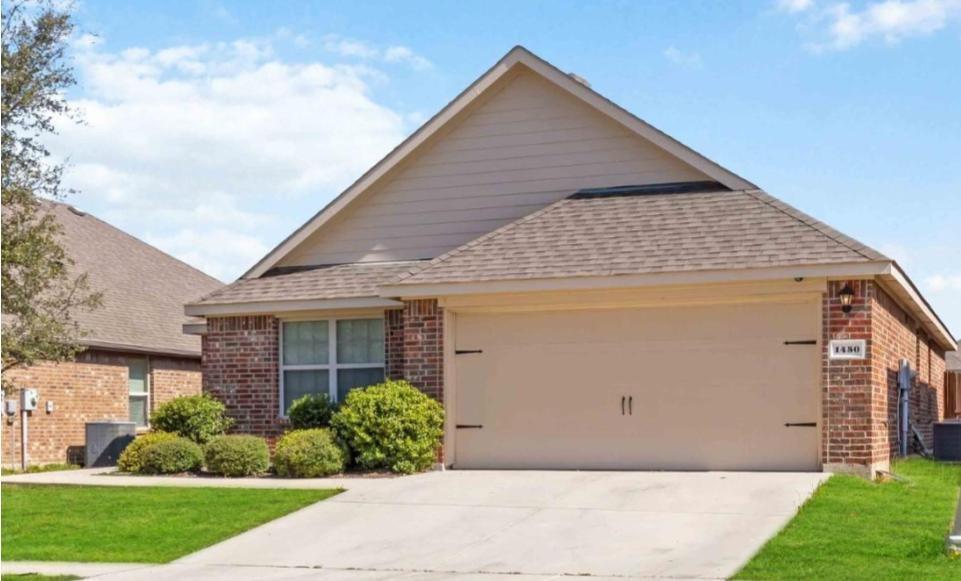 1450 Arabella Avenue Forney, TX 75126 - Photo 4 of 40 a front view of a house with a garden
