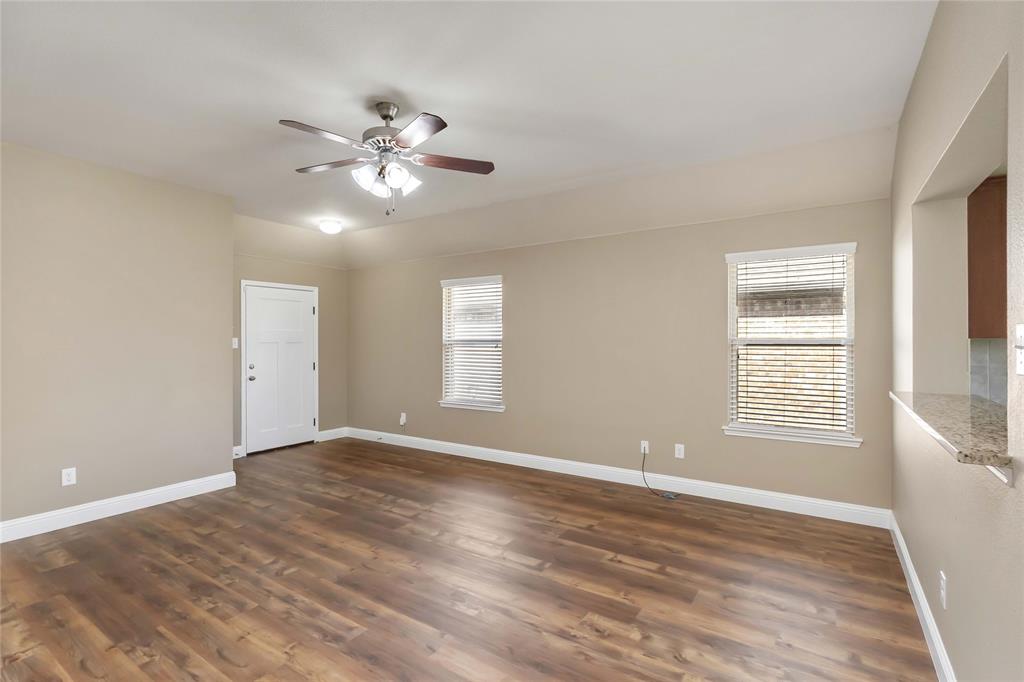 1450 Arabella Avenue Forney, TX 75126 - Photo 6 of 40 a view of an empty room with window and chandelier fan