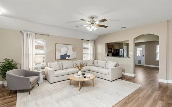 a living room with furniture and a large window