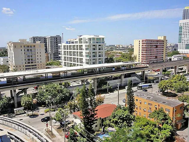a kitchen with a sink and stainless steel appliances