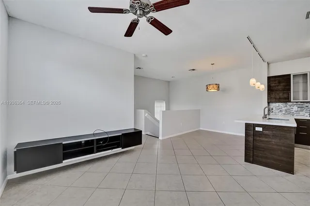 a living room with a bath tub and a chandelier