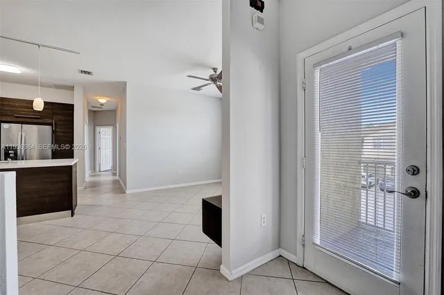 a view of a walk in closet and bathroom