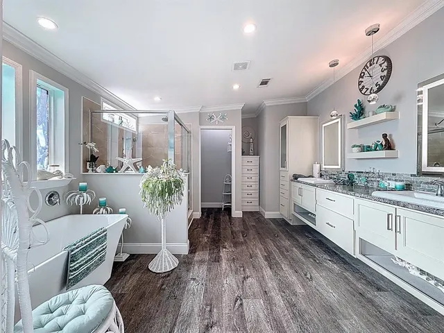 a large white kitchen with a large window