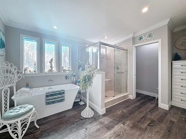 a spacious bathroom with a granite countertop sink and a mirror