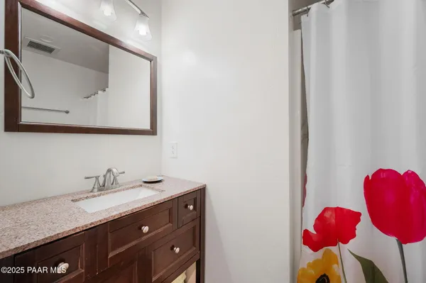 a view of a roof deck with furniture